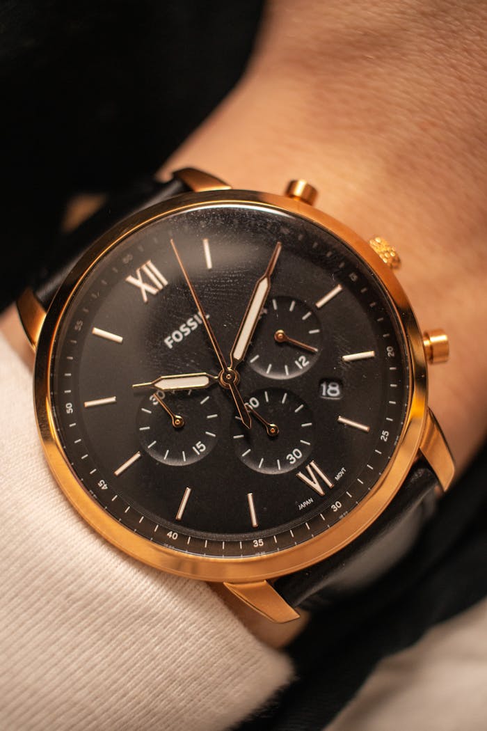 menu-13 Close-up of a stylish gold wristwatch, showcasing luxury watch design.